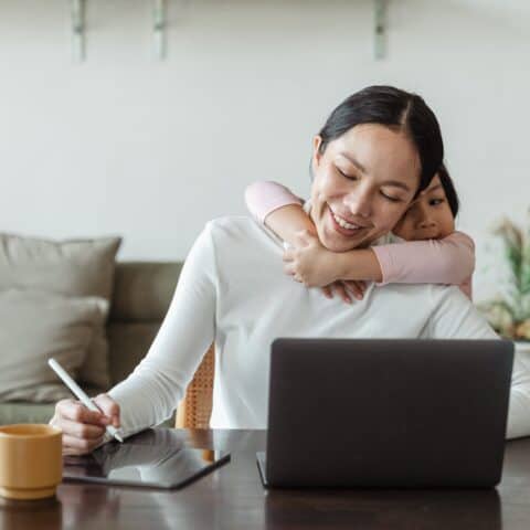 Woman with Child Working Filler Image