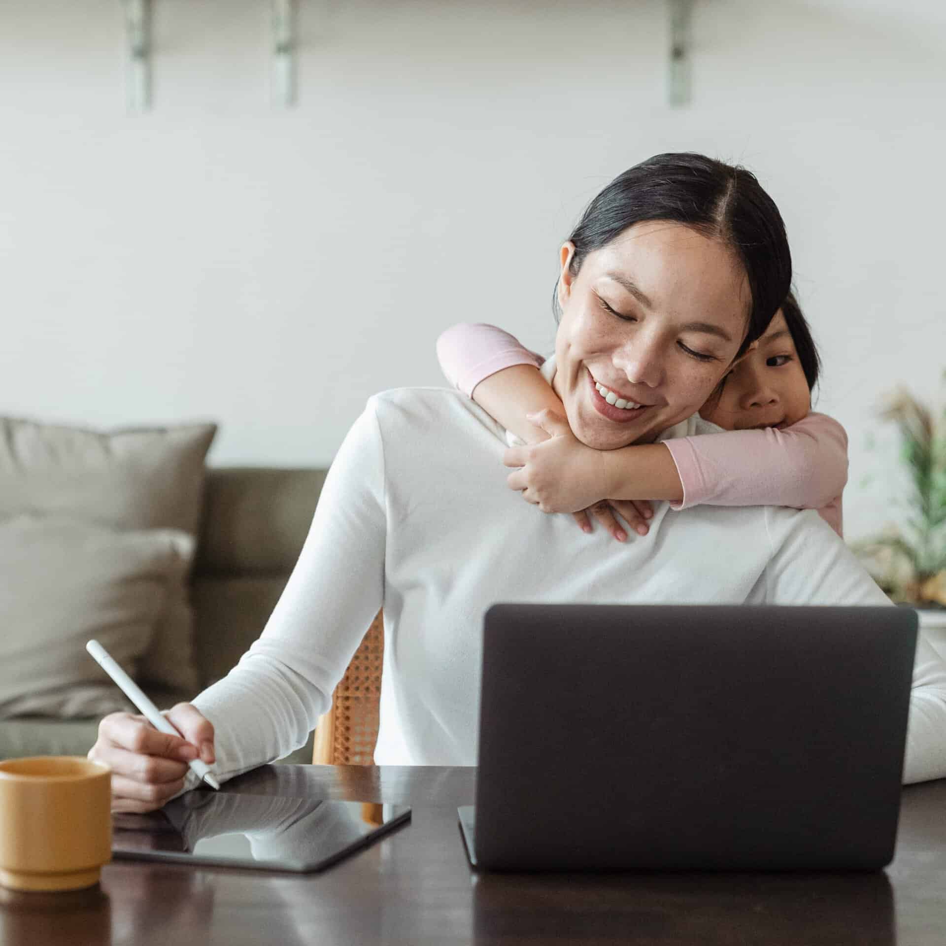 Woman with Child Working Filler Image
