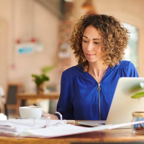 Woman Working in A Coffee Shop Filler Image